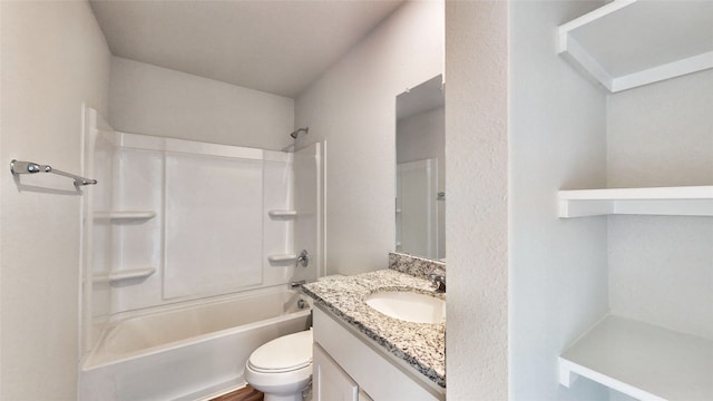 full bathroom with vanity, toilet, and  shower combination