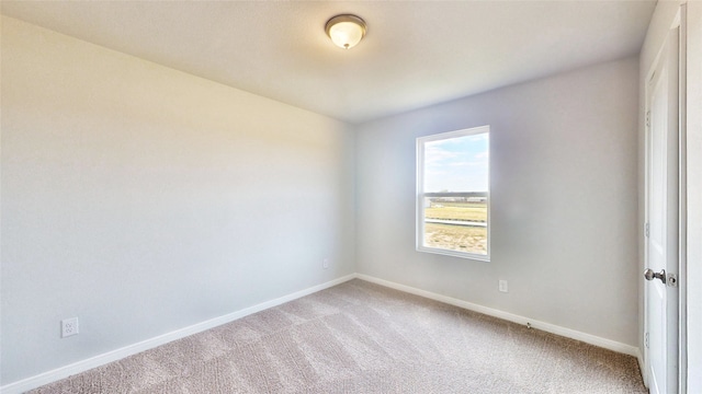 empty room with light colored carpet