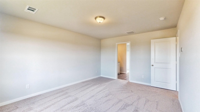 unfurnished bedroom featuring light carpet