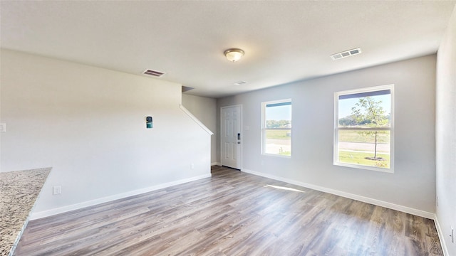 spare room with light wood-type flooring