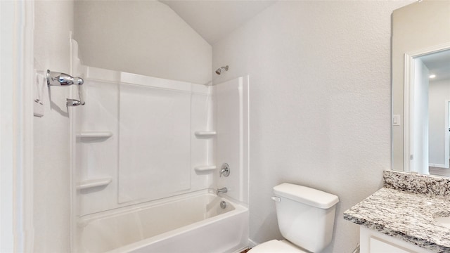 full bathroom featuring vaulted ceiling, shower / washtub combination, vanity, and toilet