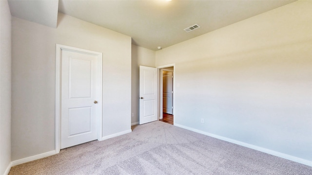 unfurnished bedroom featuring carpet