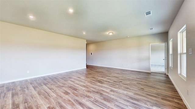 unfurnished room featuring light hardwood / wood-style floors