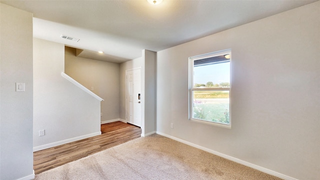 unfurnished room featuring hardwood / wood-style floors