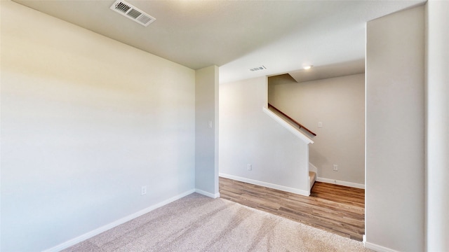 spare room with light hardwood / wood-style flooring