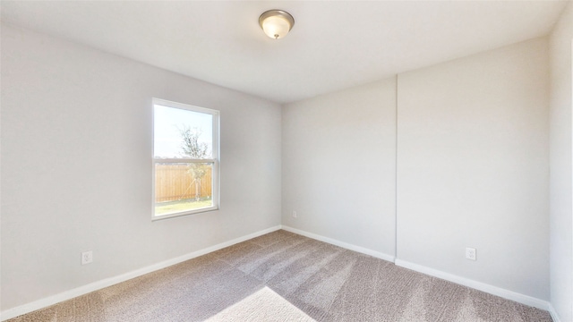 unfurnished room with carpet