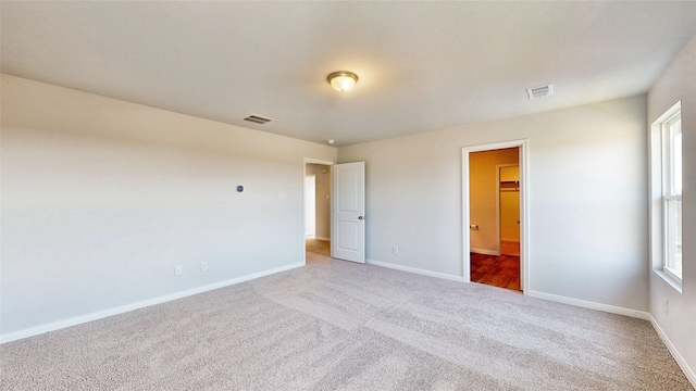 interior space with carpet floors and a walk in closet