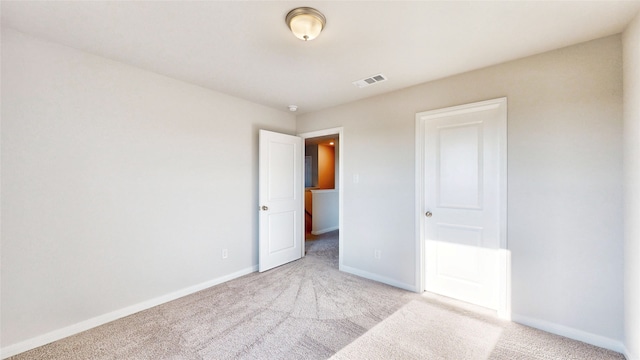 unfurnished bedroom with light carpet