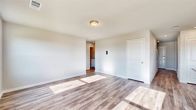 unfurnished room featuring light hardwood / wood-style floors