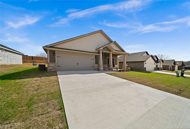 craftsman-style home with central AC unit, a front yard, and a garage