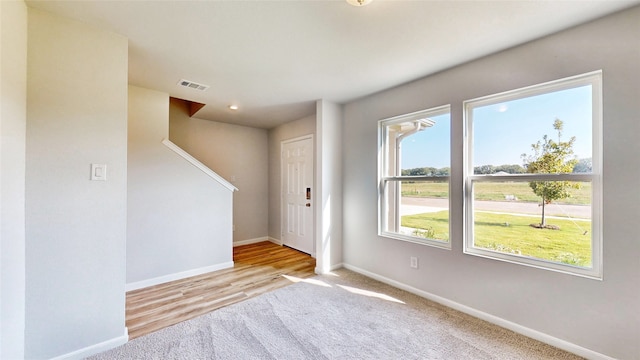 spare room featuring light hardwood / wood-style floors