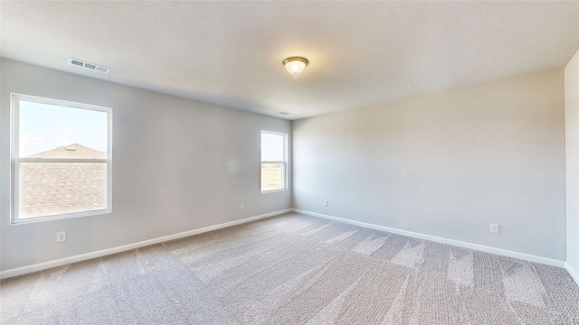 spare room featuring carpet floors