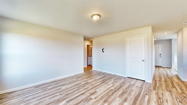 unfurnished room featuring light hardwood / wood-style floors