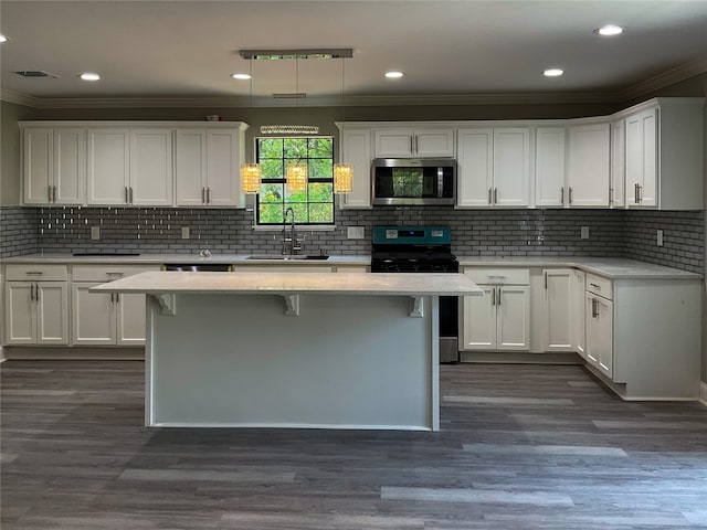 kitchen with appliances with stainless steel finishes, sink, and tasteful backsplash