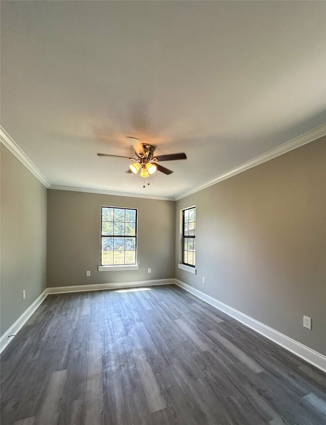 spare room featuring ceiling fan, dark hardwood / wood-style flooring, and crown molding