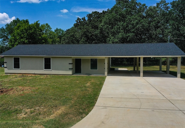 single story home featuring a front lawn and a carport