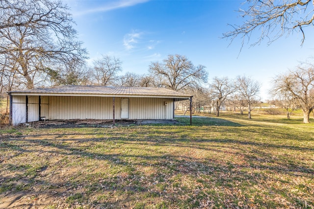 view of outbuilding with a lawn