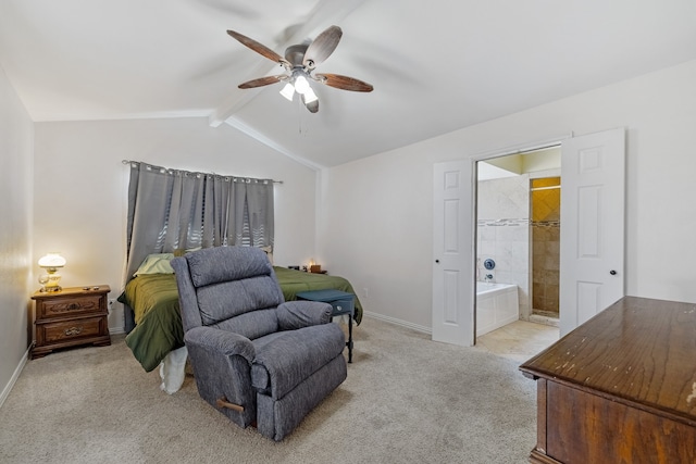 carpeted bedroom featuring ceiling fan, vaulted ceiling with beams, and ensuite bathroom