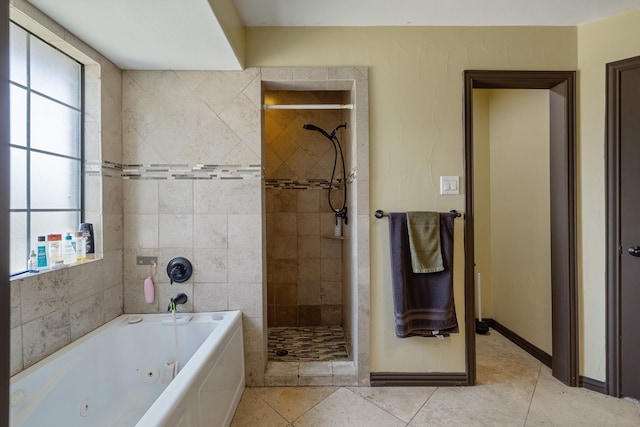 bathroom with tile walls, independent shower and bath, and tile patterned floors