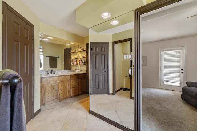 bathroom with tile patterned flooring and vanity