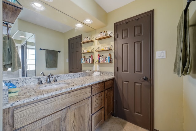 bathroom with tile patterned flooring and vanity