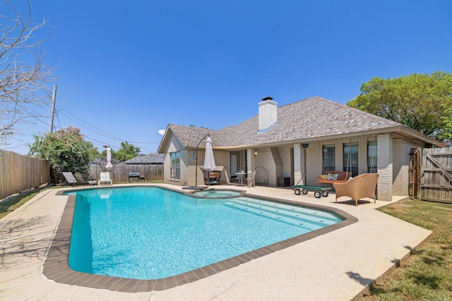 view of swimming pool with a patio