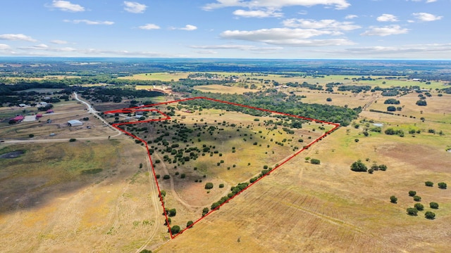 birds eye view of property featuring a rural view