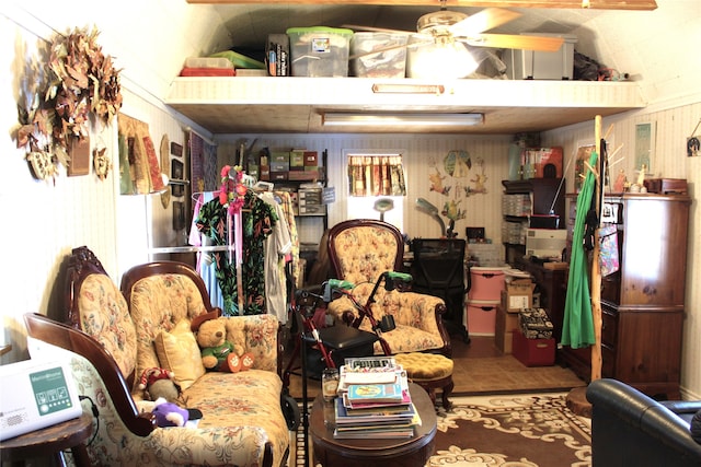 interior space with ceiling fan and vaulted ceiling