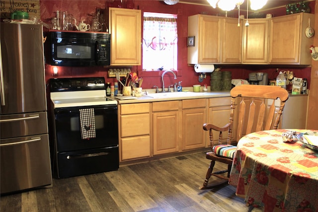 kitchen with black appliances, light brown cabinetry, sink, and dark hardwood / wood-style floors