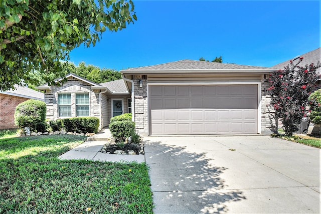 ranch-style house featuring a front yard and a garage