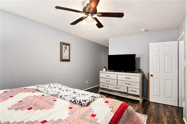 bedroom with ceiling fan and dark hardwood / wood-style flooring