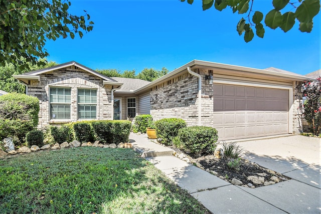 ranch-style home with a garage and a front yard