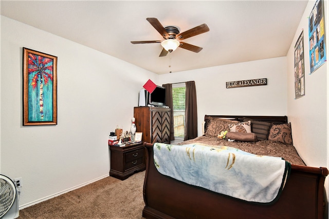 bedroom featuring ceiling fan and carpet