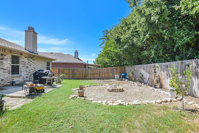 view of yard with a patio area and a fire pit