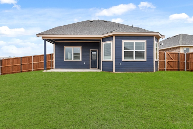 back of property featuring a patio and a lawn