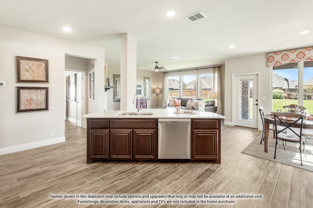 kitchen with sink, a center island with sink, light hardwood / wood-style floors, and dishwasher