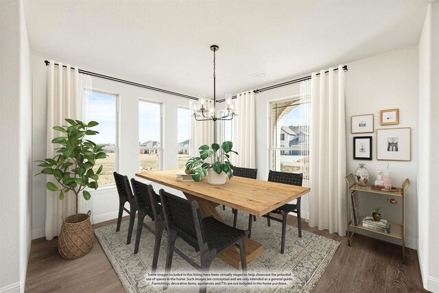 dining space featuring plenty of natural light, a notable chandelier, and hardwood / wood-style flooring