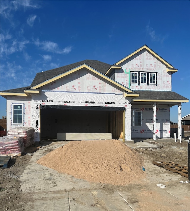 unfinished property with a garage