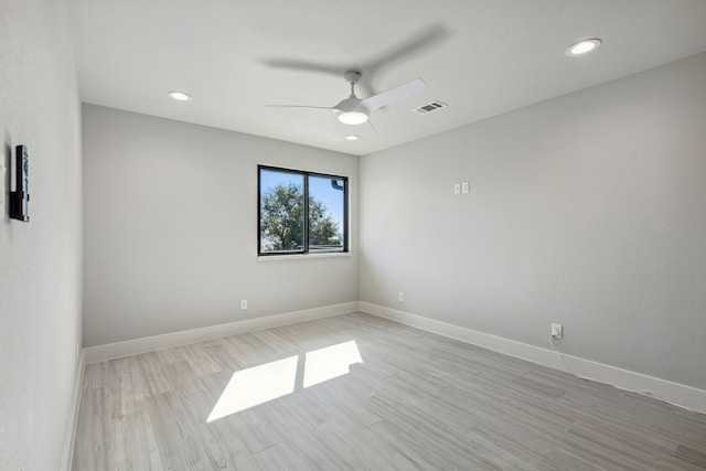 unfurnished room with ceiling fan and light hardwood / wood-style flooring