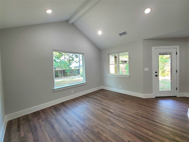 spare room featuring dark hardwood / wood-style floors and lofted ceiling with beams