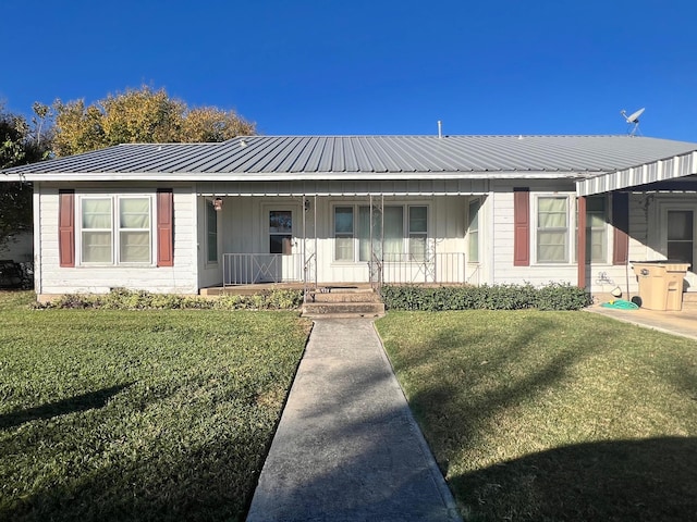 ranch-style home featuring a porch and a front lawn