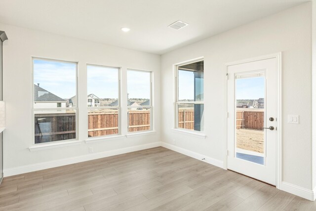 kitchen featuring stainless steel appliances, decorative backsplash, sink, white cabinets, and light colored carpet