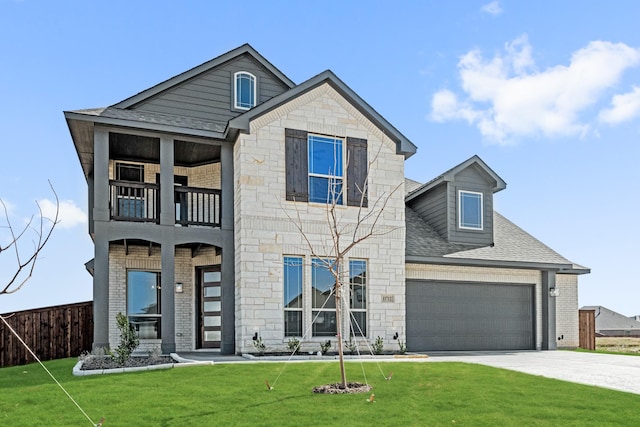 view of front of property with a balcony and a front yard