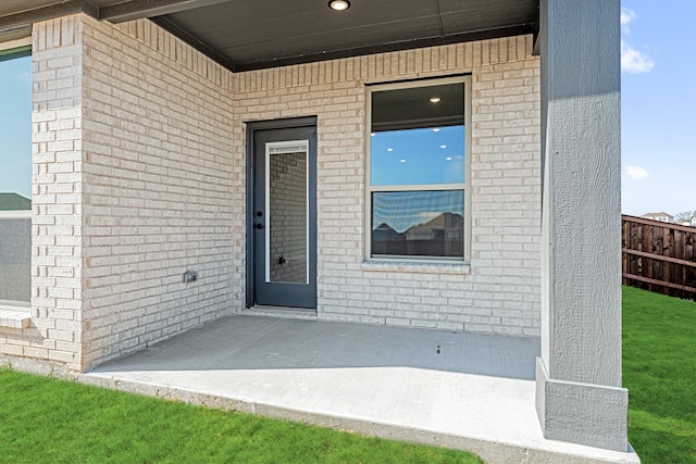 property entrance featuring a patio area