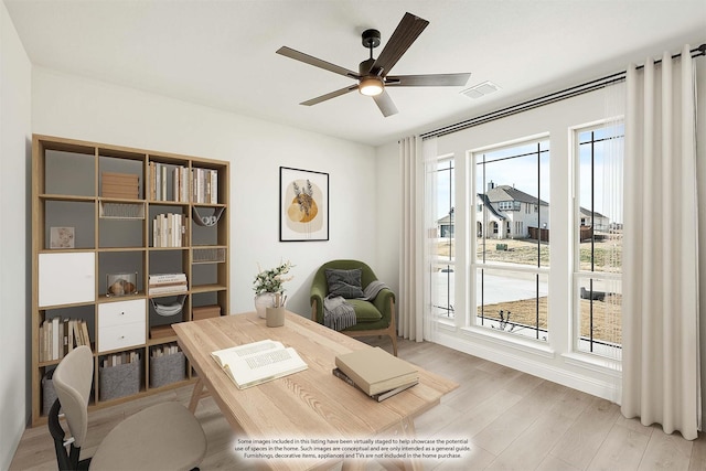 office space with light hardwood / wood-style floors and ceiling fan