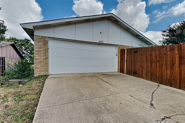 garage featuring fence