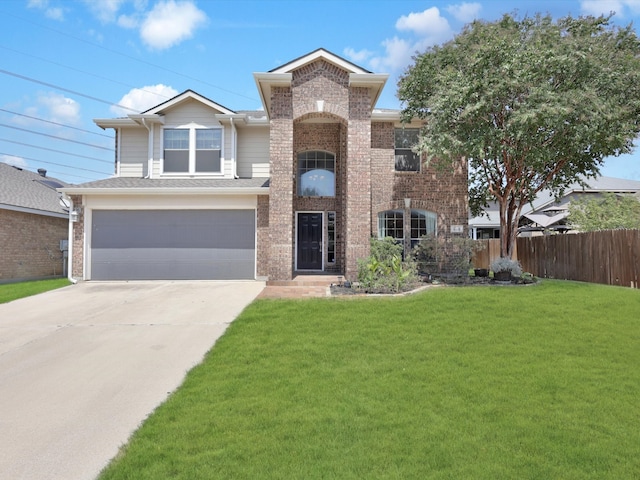 view of front of house featuring a front lawn and a garage