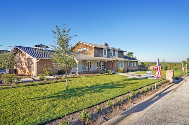 view of front of house featuring a front yard and a porch