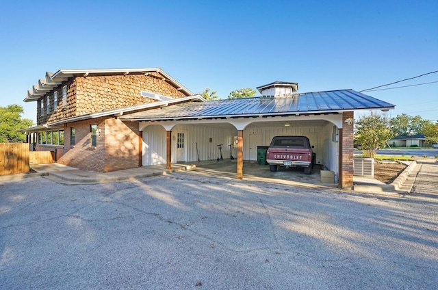 view of front of home with a carport