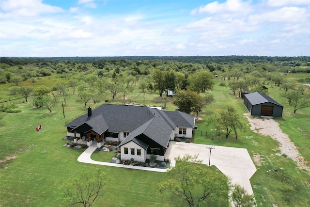 birds eye view of property with a rural view